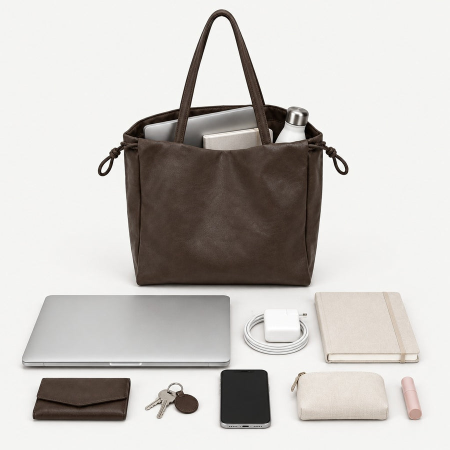 What fits inside the Elara Woven Tote bag