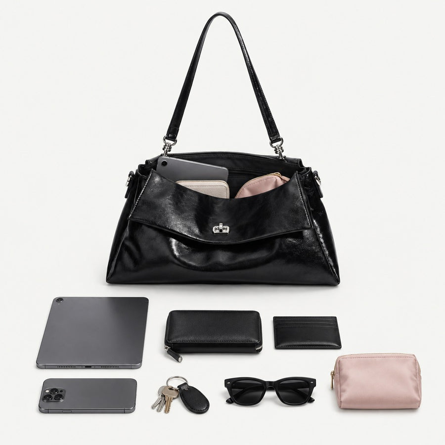 What fits inside the Nola Genuine Leather bag